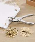 All In One Paper Fastener Kit With Hole Punch Tool And Golden Brads For Crafts, Scrapbooking, And Card Making, 100 Pcs Metal Fasteners, Smooth Paper Piercing, Easy Setup. Metal hole punch and golden brads with paper stack