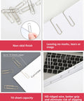 Image showing No Slip Paper Clips Set, 600 Count In Six Boxes Of 100 Each, One And Two Sevenths Inch By One Third Inch, Heavy Gauge Steel with ridged wire in use on paper demonstrating grip and non-slip finish.