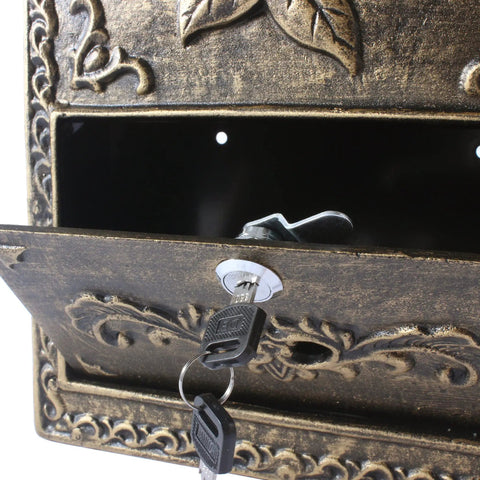 Close-up of Vintage Wall Mounted Mailbox With Lock Cast Aluminum Outdoor Letter Box, showing key in lock and decorative details.