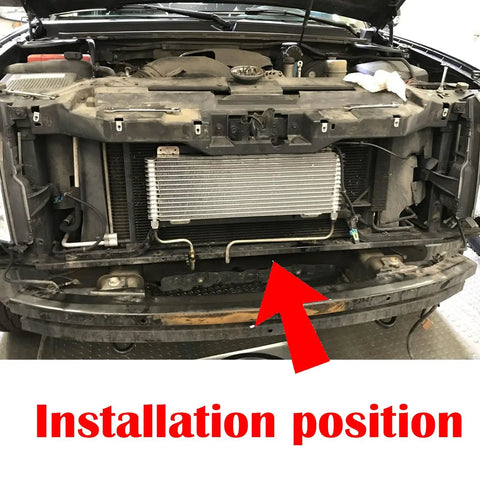 Low Pressure Transmission Oil Cooler installation in engine bay for Heavy Duty Towing and RVs, shown with mounting arrow