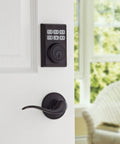 SmartCode Electronic Door Deadbolt 99090-023 With Smart Key Venetian Bronze Finish Keyless Entry on white door