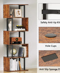 Top Shelf Six Tier Bookshelf With Sleek S Shaped Design, Rustic Brown Geometric Storage Rack showcasing staggered shelves with decor.
