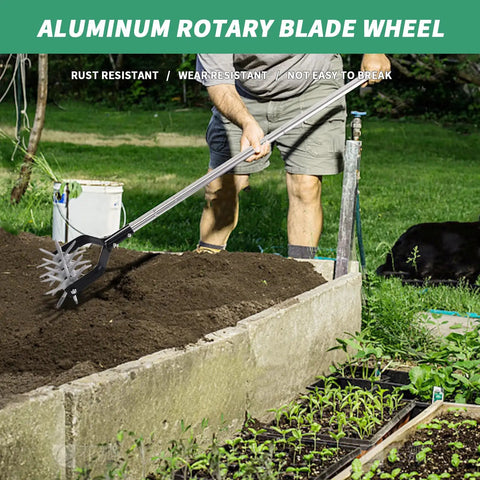 Man using rotary cultivator garden tool with adjustable long handle hand tiller for aerating and planting soil in raised bed