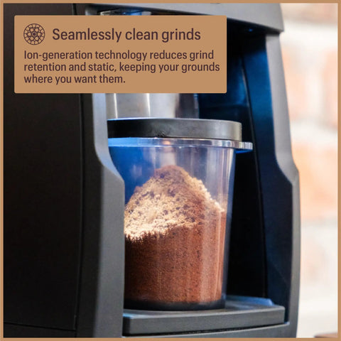 Close-up of ground coffee in the container of Pro Tier Stepless Grind Adjustment Coffee Grinder Featuring Precision Steel Burrs And Quick Release Design.