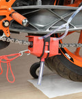 All Models Motorcycle Chain Cleaning Kit With Lube Device And Brush Gear Cleaner Tool For Chains, Easy Wash And Lubing Maintenance Accessory That Fits All Models And Bikes, Heavy Duty Red Finish installed on motorcycle chain with red finish.