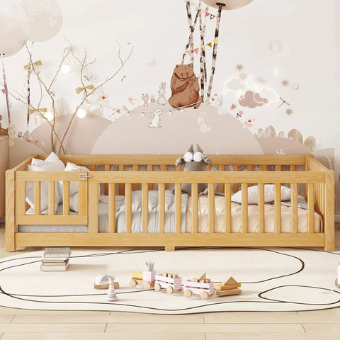 Twin Montessori Floor Bed Frame In Natural Pine With Attached Safety Fence Gate Low Profile Design showcasing cozy nursery setup.