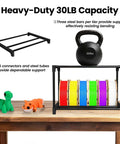 Heavy Duty 54 Spools 3D Printer Filament Storage Rack with kettlebell weight test and vibrant spools on wooden desk.
