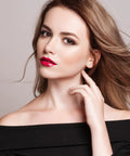 Premium Top Shelf 4Mm Titanium Stud Earrings For Sensitive Ears worn by a model, showcasing a sleek design against her shoulder.