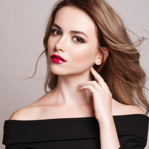 Premium Top Shelf 4Mm Titanium Stud Earrings For Sensitive Ears worn by a model, showcasing a sleek design against her shoulder.