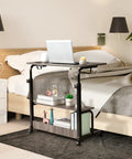 Hella Sturdy Adjustable Standing Desk On Smooth Lockable Wheels, Super Slick Rolling Laptop Station With Storage Shelves, Easy Setup Grey Oak Home Office Daily Driver by bed with laptop.