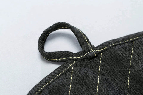 Close-up of X Pad Suppressor Handler for Tactical Duty Gear with CarbonX heat resistance, Kevlar stitching loop detail in black.