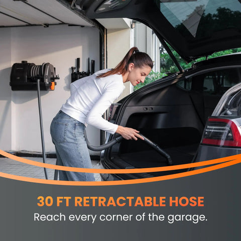 Woman using Wet Dry Vacuum Cleaner With 6 Nozzles, 30 Ft Retractable Hose, Wall Mounted Car Detailing Vacuum For Garage And Home Use