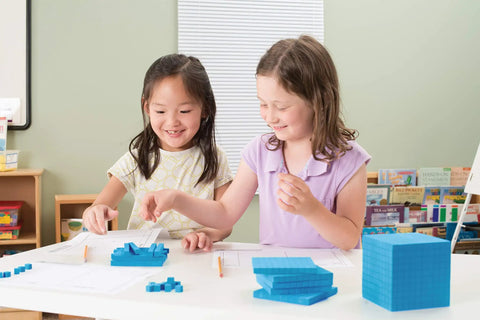 Children using Blue Base Ten Blocks Classroom Set For Math Practice, Hands On Place Value Cubes For Kids, including thousands cube.