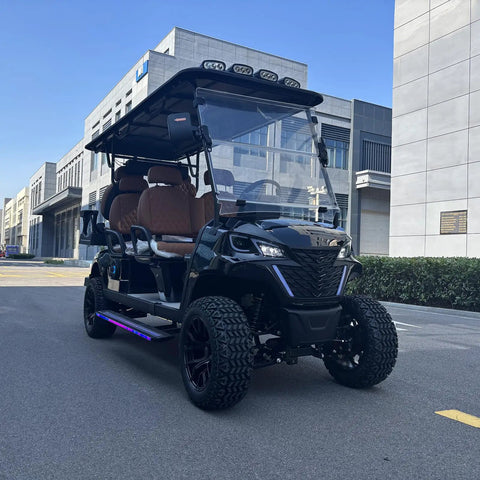 Hella Comfy 6 Seater Electric Golf Cart With Roof LED Light Bar sleek black exterior and diamond stitched leather seats.