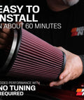 Person holding a large cylindrical Cold Air Intake System With High Flow Air Filter For Mazda RX8 2003 To 2011 Beef Up Horsepower And Torque Performance Upgrade That Lets Your Engine Breathe Easy And Roar On The Street