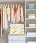 Kick Butt Foldable Storage Bin With Lid And Handles Built From Heavy Duty 300D Oxford Fabric For Roomy Collapsible Organization Crate in floral design placed in a closet.