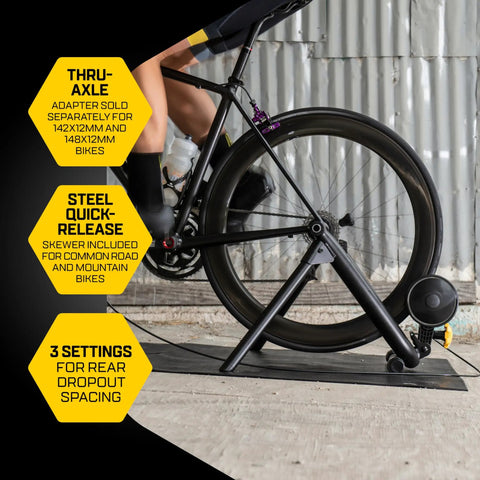 Cyclist using Magnetic Plus Indoor Bike Trainer With Wheel On Setup And Quiet Fluid Resistance for realistic rides, no wheel removal