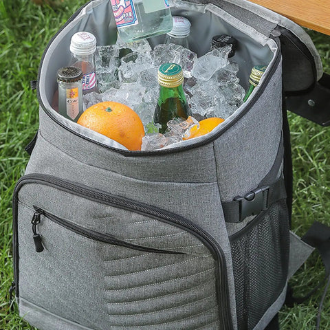 Kickass Heavy Duty Insulated Cooler Backpack With Leakproof Thermal Core And Adjustable Padded Straps For Camping Beach Hiking Keeps Snacks Ice Cold No Sweat filled with ice, drinks, and oranges.