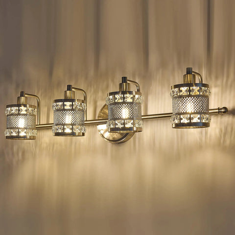 Over Mirror Four Bulb Bathroom Vanity Light With Cylinder Crystal Shade Modern Wall Sconce illuminating a room