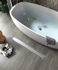 Bathroom with a bathtub and 24 Inch Brushed Nickel Linear Shower Drain Built Tough From 304 Stainless Steel That Will Not Rust Up In Wet Bathrooms