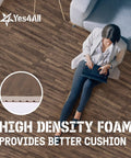 Person sitting on Interlocking EVA Foam Floor Tiles Puzzle Mats With Border 24x24 Inches for home, laptop on lap.