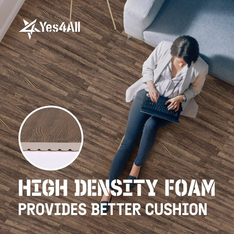 Person sitting on Interlocking EVA Foam Floor Tiles Puzzle Mats With Border 24x24 Inches for home, laptop on lap.
