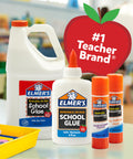 Various Elmer's school glue products, including clear liquid school glue for arts and crafts, in a classroom setting.