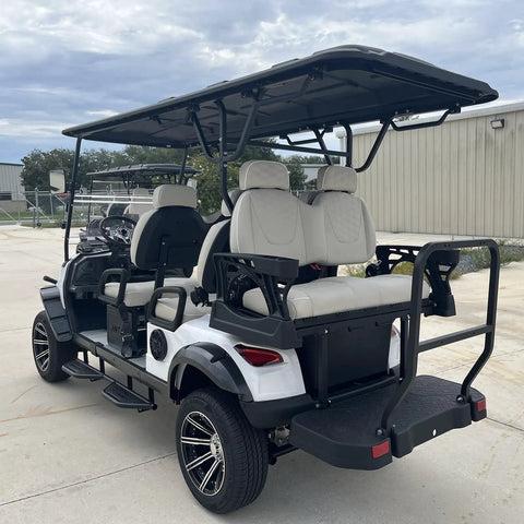 High Capacity Six Passenger Electric Golf Cart Featuring Rear Flip Seats Quiet Motor Drive with plush padded upholstery.