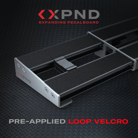 Xpnd Pedalboard Expansion Kit For Guitar Pedal Boards, Telescoping 14 To 24 Inch Extension on black surface with loop Velcro