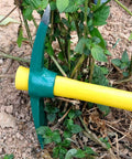15 Inch Mattock With Dual Head Weeding Hoe And Pick Axe Heavy Duty Garden Tool with Non Slip Handle in a garden setting