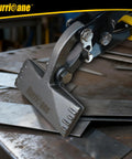 Offset hand seamer for roofing bending sheet metal on a workbench, pro-grade tool with 3-inch offset for precise folds in metalwork.