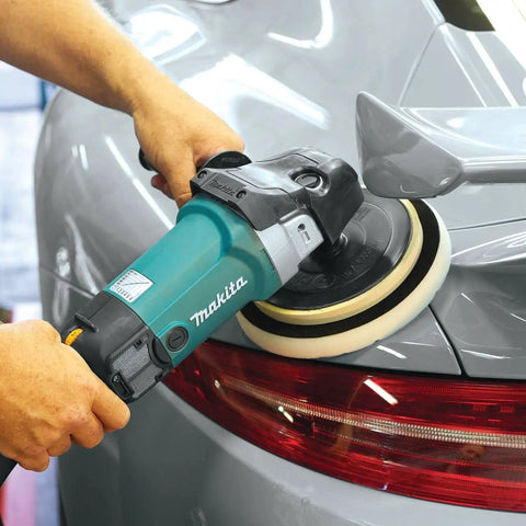 7-Inch Polisher With Pro Grade Variable Speed Dial used on car trunk for detailing, showing blue body and rubberized loop handle