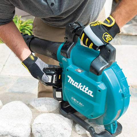 User attaching battery to Game Changing Cordless Leaf Blower Kit Equipped With A Brushless Motor Pumping 473 CFM And 120 MPH Air.