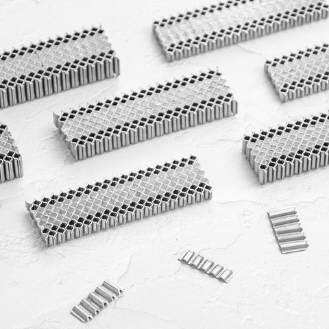 Corrugated W Fasteners 25 Gauge 1 Inch Crown Three Eighths Inch Length Staples For Pneumatic Staplers And Woodworking Projects 1200 Count Box Glue Collated For Easy High Performance Tacking And Framing shown in stacks on white background