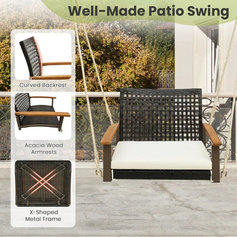 One Person Outdoor Porch Swing With Metal Frame And Soft Cushioned Seat Wicker Style Chair Ropes And Hooks Included PE Rattan Swing in off white with curved backrest and acacia wood armrests.