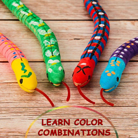 Colorfully painted wooden snakes from the Ten Piece Unfinished Wooden Snakes Craft Kit With Jointed Wiggly Bodies displayed on wood surface.