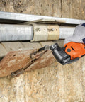 Person using Starlock Plus E Cut Carbide Pro Saw Blade TiN Coated for cutting metal panel