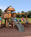 Cedar Wood Swing Set With Wave Slide And Elevated Clubhouse Play Kitchen And Picnic Area Belt And Web Swings Rock Wall