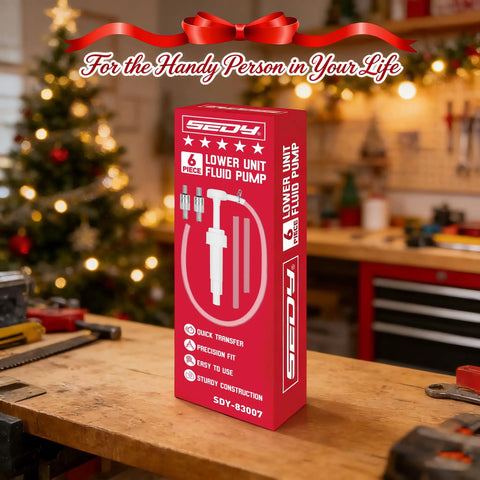 Marine Lower Unit Gear Oil Pump Kit package on workbench near Christmas tree, focus on product and festive background.