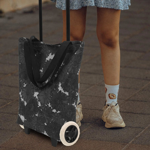 Foldable utility cart with 6.69 inch replacement laundry cart wheels for durable rolling and easy maneuverability, used outdoors.