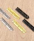 Antique Bronze Wood Box Hinges 4 Pack 65 By 15mm Gold Cabinet Hardware for Jewelry Chests displayed on wood surface