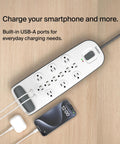 12 Outlet Surge Protector Power Strip With USB Ports, 6 Ft Flat Plug Extension Cord, 3996 Joules Protection, white on table
