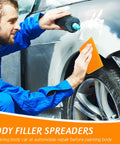 Mechanic using Six Piece Body Filler Spreaders Set for DIY Auto Body Repair on car fender, trapezoid plastic tool in use