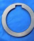 Top Shelf Bulk Lot Of Eight Precision Milling Machine Arbor Spacers For Your Shop Rig One Inch To One Nine Sixteenths Inside Diameter Tooling Accessories Built Damn Tough And Seriously Reliable For Daily Machining Projects, single metal arbor spacer on blue background.