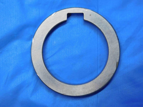 Top Shelf Bulk Lot Of Eight Precision Milling Machine Arbor Spacers For Your Shop Rig One Inch To One Nine Sixteenths Inside Diameter Tooling Accessories Built Damn Tough And Seriously Reliable For Daily Machining Projects, single metal arbor spacer on blue background.
