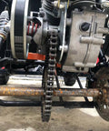 Forward Reverse Gearbox Kit For Go Karts With 11 To 18 HP Engines installed on vehicle, showing chain and sprocket detail