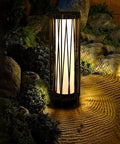 Outdoor Solar Floor Lamp With Rattan Trim And Steel Frame, Waterproof Patio Lantern illuminating garden path