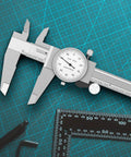 Two Way Shockproof Dial Caliper 0-6 Inch Range With 0.001 Inch Resolution on green cutting mat