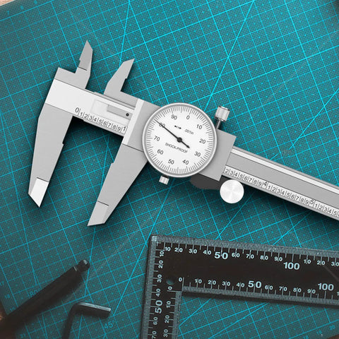 Two Way Shockproof Dial Caliper 0-6 Inch Range With 0.001 Inch Resolution on green cutting mat