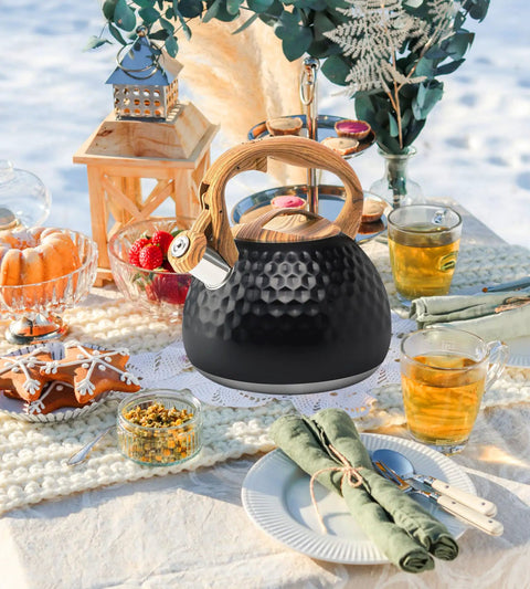 Stovetop Tea Kettle 3.2 Quart Stainless Steel Whistling Teapot With Wood Pattern Handle on outdoor table setting